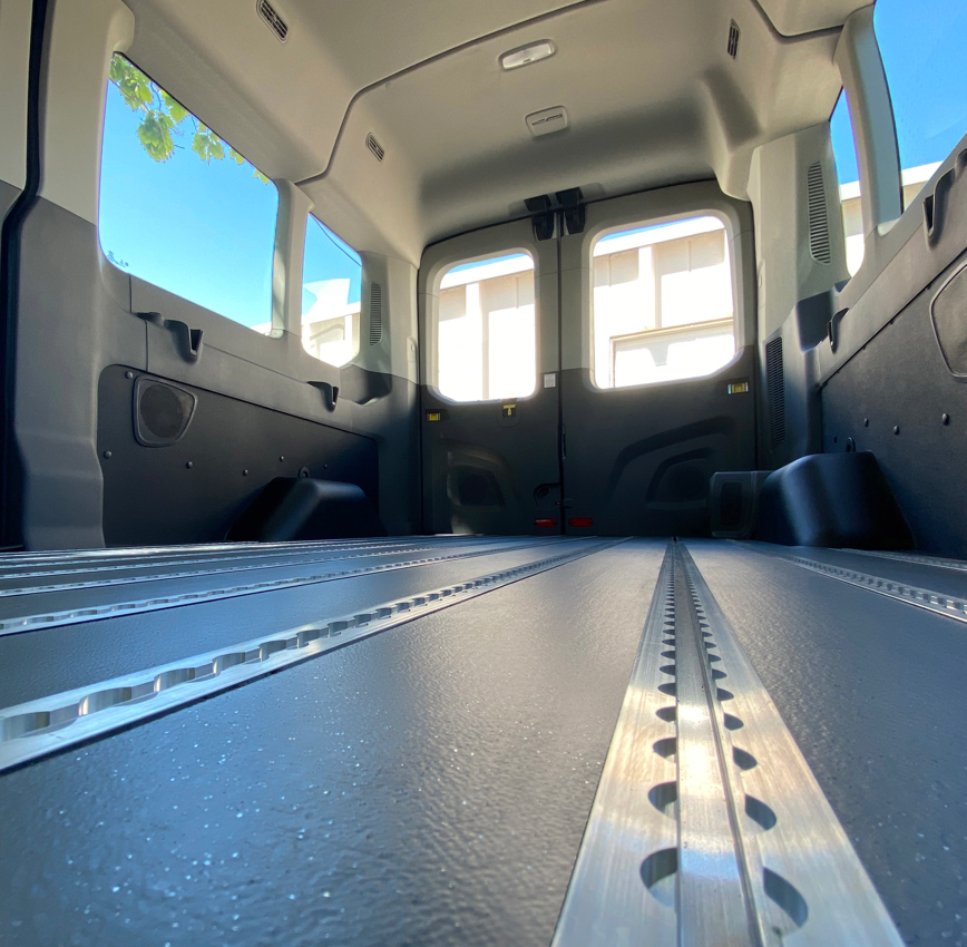 An ALFO floor seen from close-up facing the back door of the van it is installed in